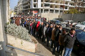 Long queues outside settlement center for temporary protection cards - Syria