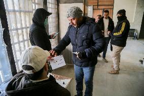 Long queues outside settlement center for temporary protection cards - Syria