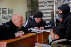 Long queues outside settlement center for temporary protection cards - Syria