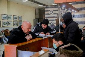 Long queues outside settlement center for temporary protection cards - Syria