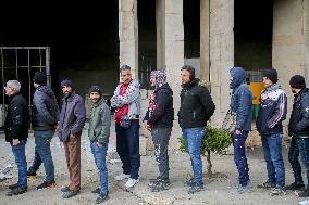 Long queues outside settlement center for temporary protection cards - Syria