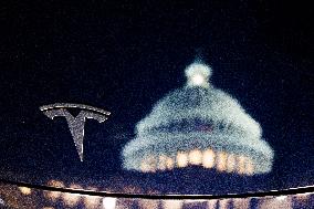 Tesla Logo And Capitol Building