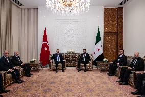 Turkish FM Hakan Fidan meets HTS Leader Ahmed al-Sharaa - Damascus