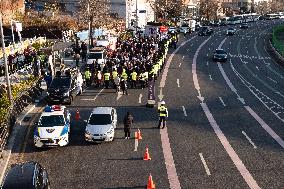 Citizens March To Presidential Residence Holding A Self-Issued Emergency Arrest Warrant