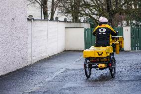 Deutsche Post Letter Carrier On A Bicycle