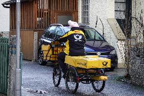 Deutsche Post Letter Carrier On A Bicycle