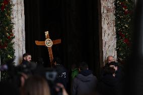 Pilgrims pass through the Holy Door