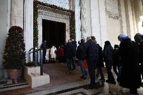 Pilgrims pass through the Holy Door