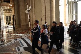 Pilgrims pass through the Holy Door