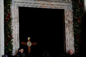 Pilgrims pass through the Holy Door