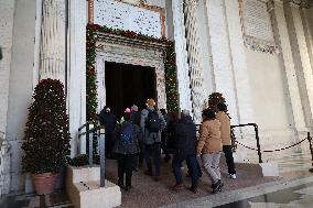 Pilgrims pass through the Holy Door