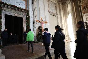 Pilgrims pass through the Holy Door