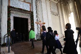 Pilgrims pass through the Holy Door