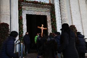 Pilgrims pass through the Holy Door