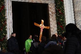 Pilgrims pass through the Holy Door