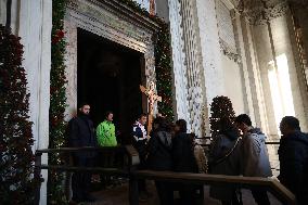 Pilgrims pass through the Holy Door