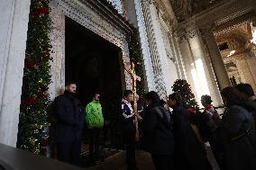 Pilgrims pass through the Holy Door