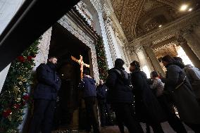 Pilgrims pass through the Holy Door