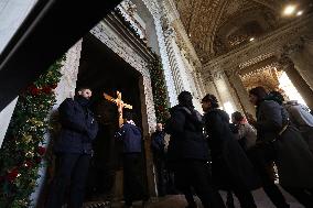 Pilgrims pass through the Holy Door