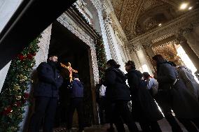 Pilgrims pass through the Holy Door