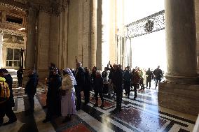 Pilgrims pass through the Holy Door