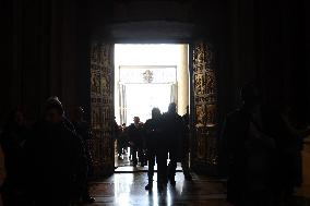 Pilgrims pass through the Holy Door