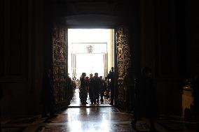 Pilgrims pass through the Holy Door