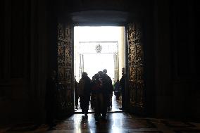 Pilgrims pass through the Holy Door