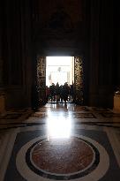 Pilgrims pass through the Holy Door