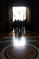 Pilgrims pass through the Holy Door