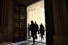 Pilgrims pass through the Holy Door