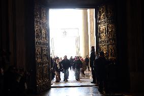 Pilgrims pass through the Holy Door