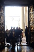 Pilgrims pass through the Holy Door