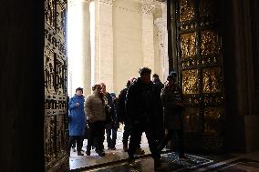 Pilgrims pass through the Holy Door