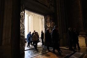 Pilgrims pass through the Holy Door