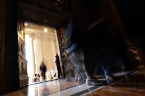 Pilgrims pass through the Holy Door