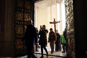 Pilgrims pass through the Holy Door