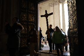 Pilgrims pass through the Holy Door