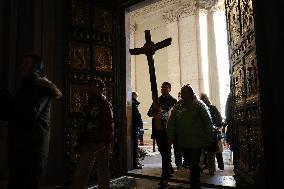 Pilgrims pass through the Holy Door