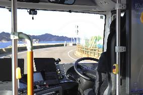 Self-driving bus begins commercial service in Ehime Pref.