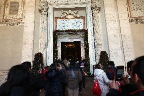 Pilgrims pass through the Holy Door