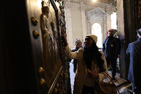 Pilgrims pass through the Holy Door