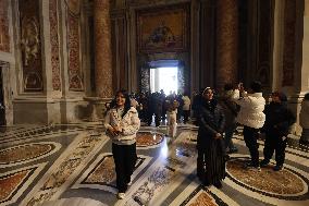 Pilgrims pass through the Holy Door