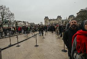 Large Crowd At Notre-Dame De Paris For First Christmas Masses