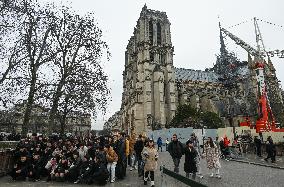 Large Crowd At Notre-Dame De Paris For First Christmas Masses