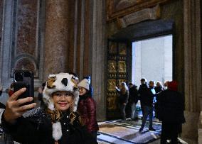 Pilgrims Walk Through The Holy Door Of St. Peter's Basilica - Vatican