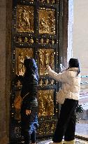 Pilgrims Walk Through The Holy Door Of St. Peter's Basilica - Vatican