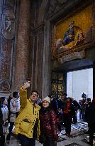 Pilgrims Walk Through The Holy Door Of St. Peter's Basilica - Vatican