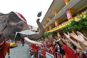 An Elephant Helps Distribute Presents To Students - Thailand