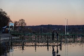 People Enjoying A Winter Evening At Lake Starnberg